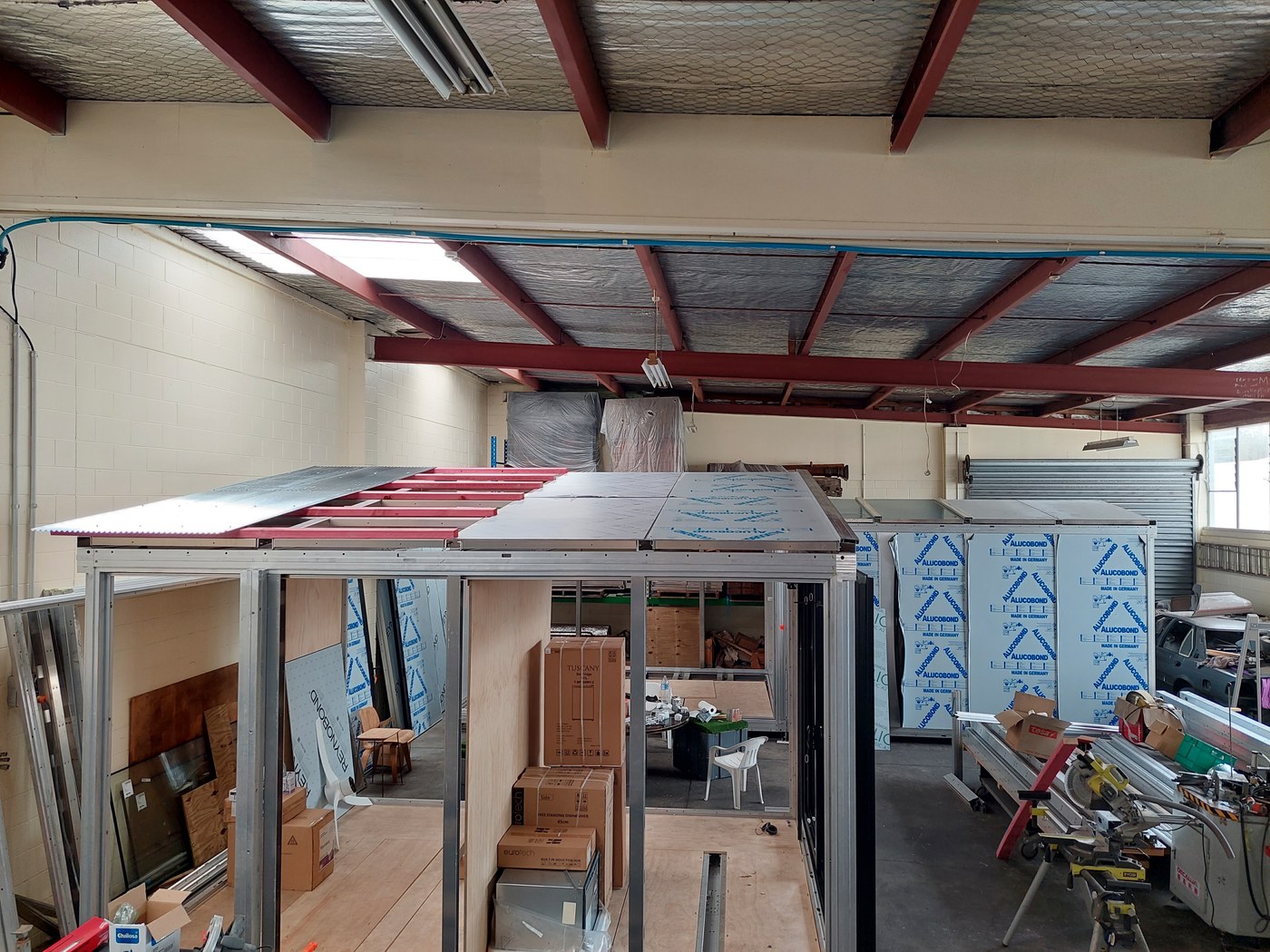 Anyplace module under construction — aluminum and timber hybrid roof